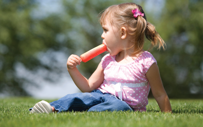 Little girl enjoying a frozen lolly
